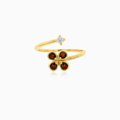 Zlatý nedokončený prsten s květinovým vzorem z granátů