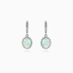 Silver hanging earrings with white opal