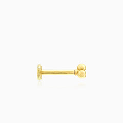 Piercing en or élégant avec design à trois petites boules
