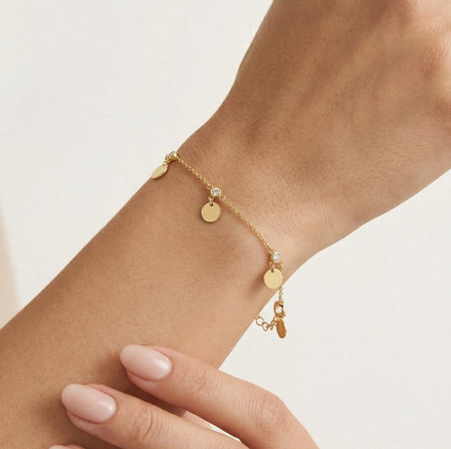 Pulsera de oro con circonitas y cuentas redondas