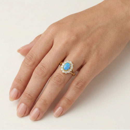 Anillo real de oro con ópalo azul