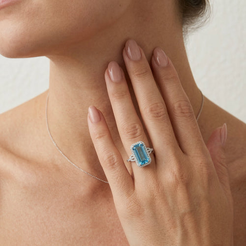 Elegant blue topaz baguette ring in white gold