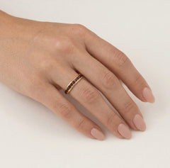 Yellow gold ring with eternity garnets in bezel set