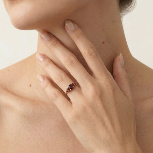 Yellow gold ring with round cut garnets