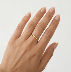 Gold ring with round cut garnet