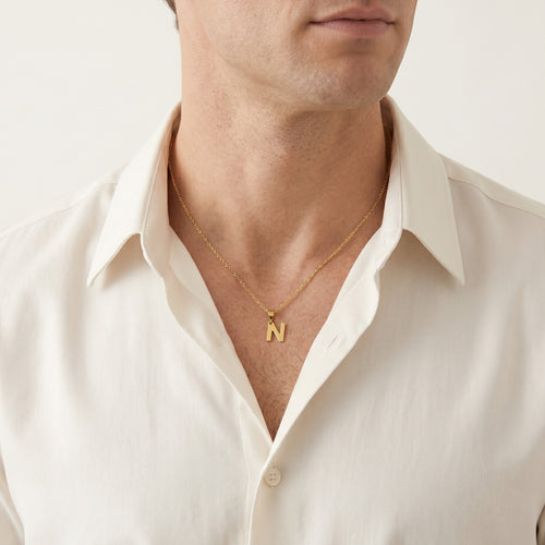 Gold pendant of letter N