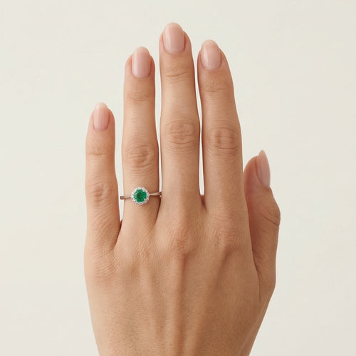 White gold diamond ring with round emerald