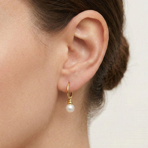 Yellow gold hoop with dangling pearl earring