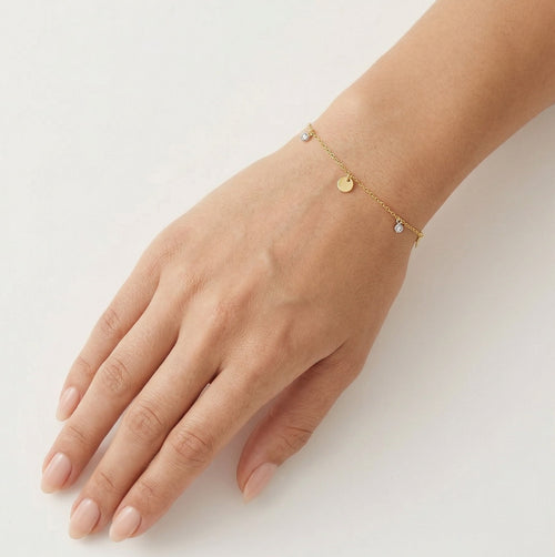 Gold dangling bracelet with zircons