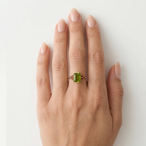 Radiant allure moldavite and garnet elegance ring