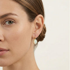 Massive oval white opal gold earrings