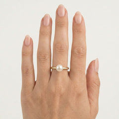 Bague en or avec zircon cubique et perle