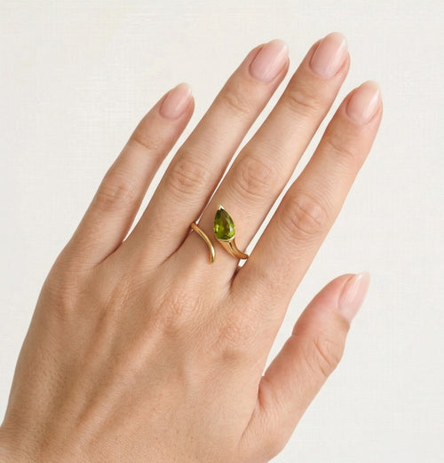 Gold ring with pear cut moldavite
