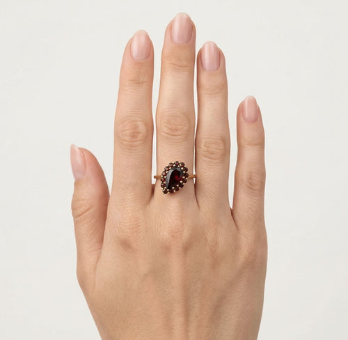 Pear and round garnet harmony ring