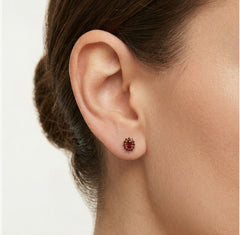 Clous d’oreilles en or avec grenat floral