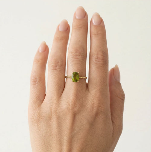 Oval moldavite gold ring with delicate details