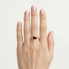 Gold ring with marquise cut garnet