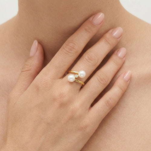 Anillo de oro con doble perla retorcida