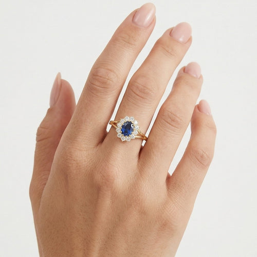 Gelbgoldring mit Zirkonia und Saphir