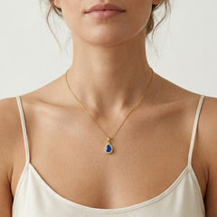 Pear-cut blue quartz gold pendant