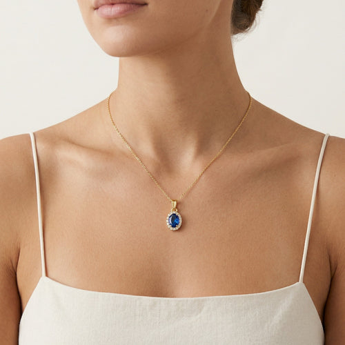 Zlatý oválný přívěsek se syntetickým safírem