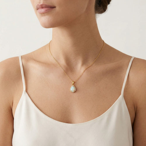 Pear white opal gold pendant