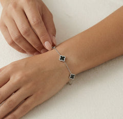 Sterling silver bracelet with onyx clovers