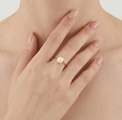 Bague torsadée en or avec perle