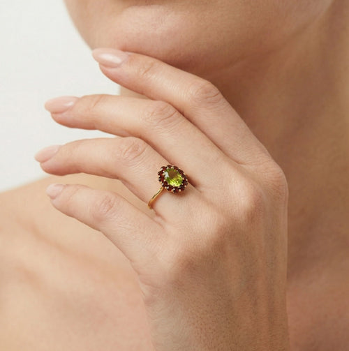 Moldavite and garnet ring in yellow gold