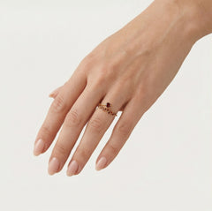 Stylish gold ring with round garnet