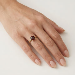 Garnet cushion cut in prong setting