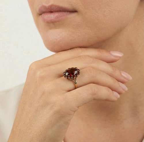Elegant oval and round garnet ring