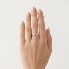 Simple gold ring with small emerald