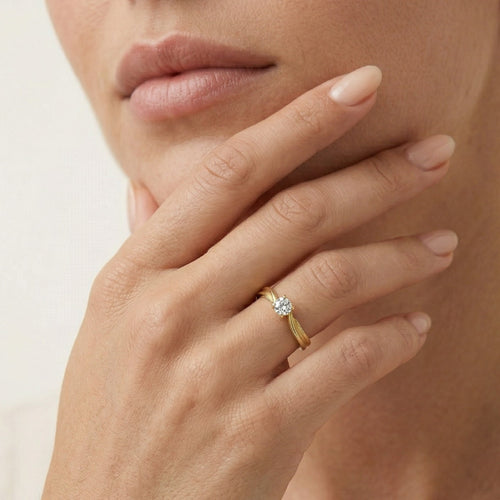 Yellow gold solitaire cubic zirconia ring