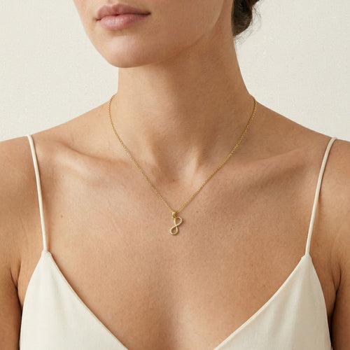 Yellow gold infinity pendant