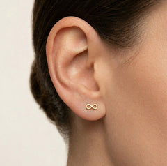 Lustrous yellow gold infinity stud earrings