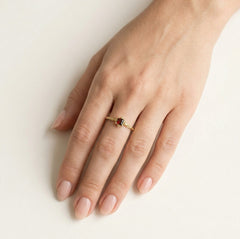 Solitaire garnet cushion cut ring