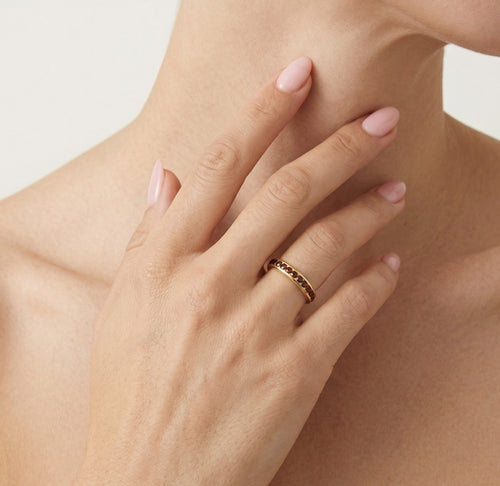 Yellow gold ring with eternity garnets in bezel set