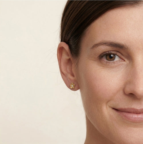 Lustrous yellow gold flower with cubic zirconia earrings