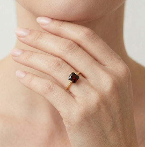 Princess cut solitaire garnet yellow gold ring