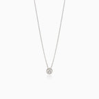 Necklace with diamond in round pendant