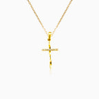 Twisted yellow gold cross with cubic zirconia