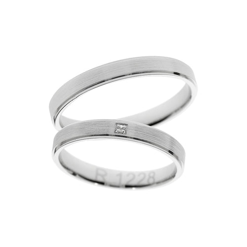 Anillo de boda de oro blanco con piedra corte princesa