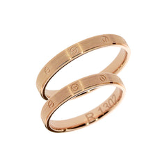 Bague de mariage en or rose avec symboles