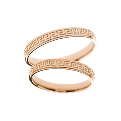 Bague de mariage en or rose avec symboles