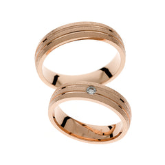 Alliance en or rose avec diamant