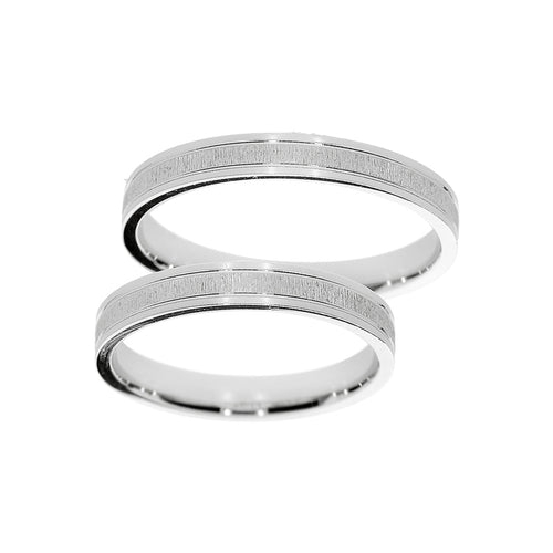 Bague de mariage en or blanc avec bande mate.