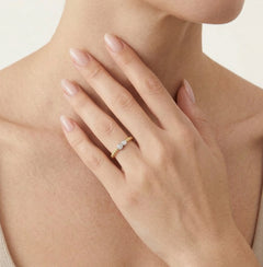 Yellow gold ring adorned with sparkling cubic zirconia