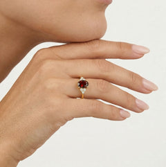 Elegant gold ring with garnet and cubic zirconia