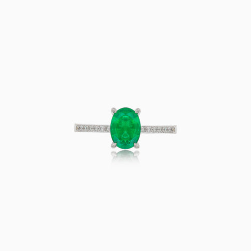 White gold ring with oval emerald and diamonds